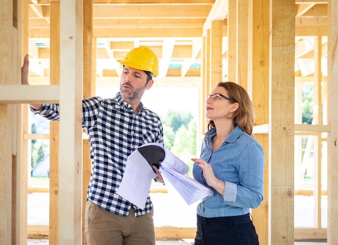Business Insurance - Contractor Showing a House in Progress to a Client